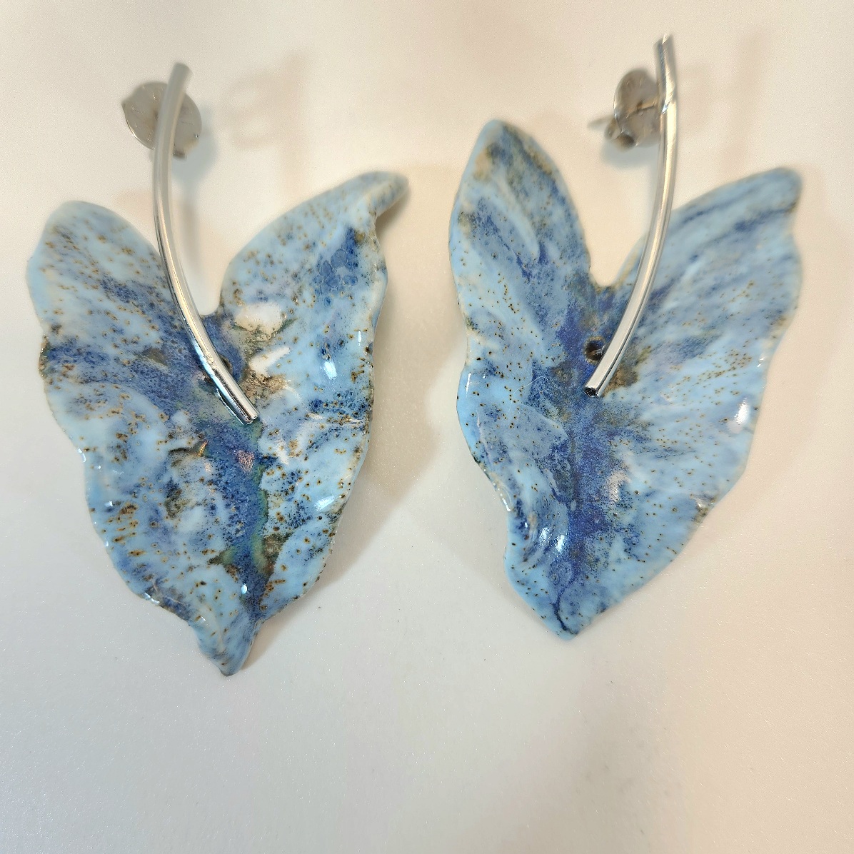 Brincos energia de borboletas