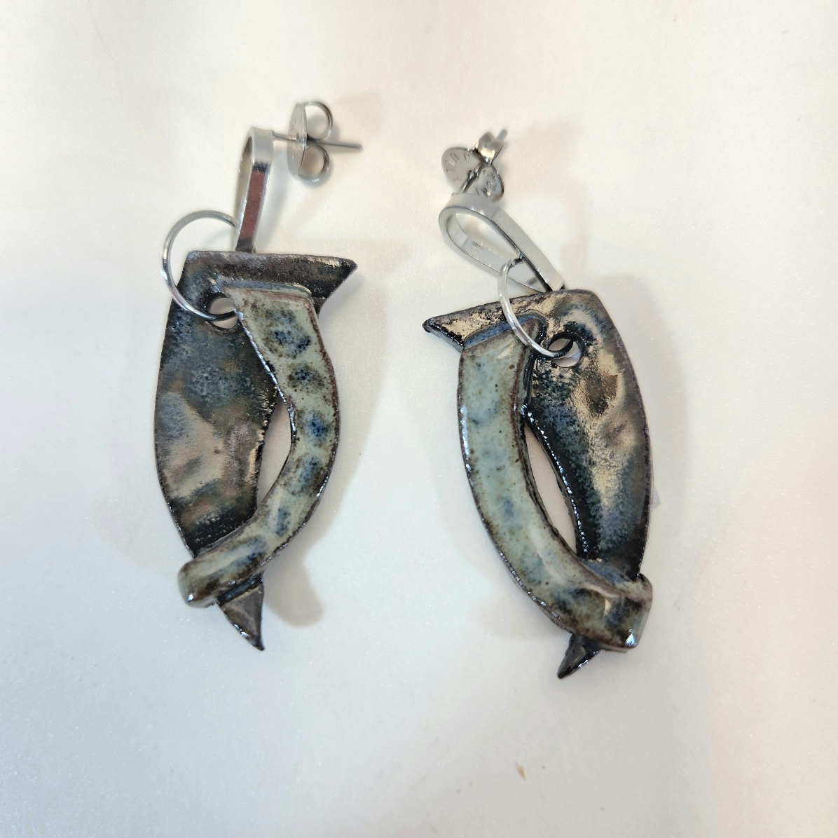 Brincos abraco de aspas.