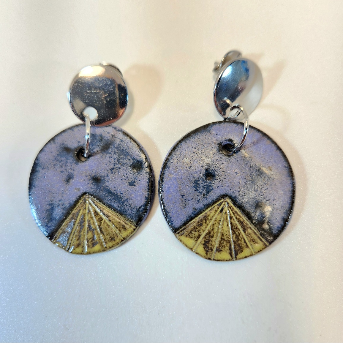 Brincos raios de luz.